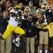 Michigan defensive back Raymon Taylor intercepts a pass meant for Notre Dame wide receiver Chris Brown during the first quarter at Notre Dame Stadium on Saturday. Melanie Maxwell I AnnArbor.com